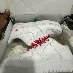 Supreme White Sneakers with Red Accents